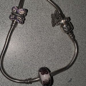 Pandora bracelet with 2 silver charms and one bead